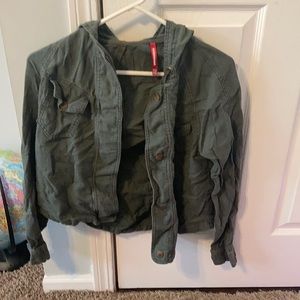 Dark green sweater with strings in the hood